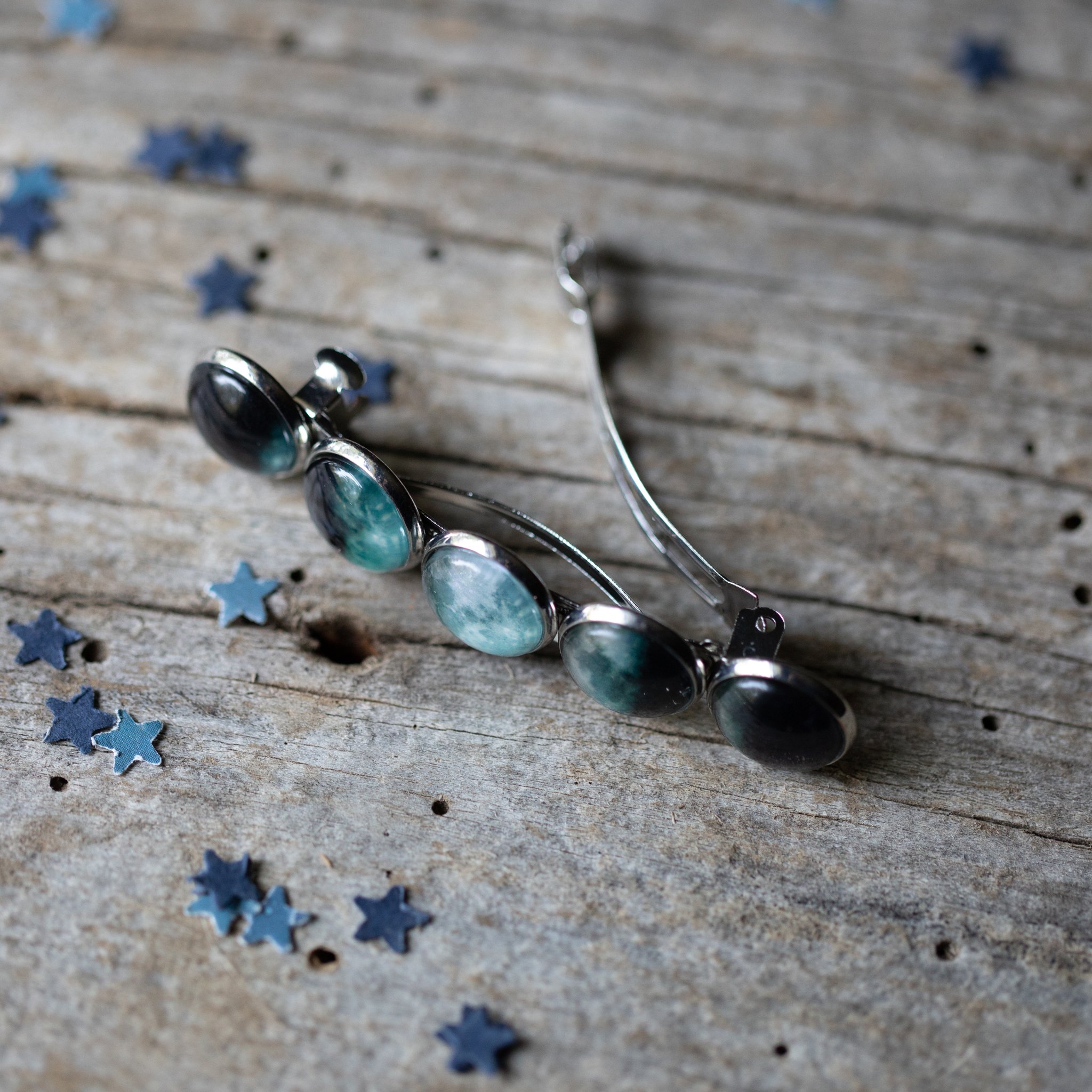 Moon Phase Hair Clip Barrette featuring five distinct moon phases, handcrafted from rhodium plated brass and glass, measuring 2.5 inches long.