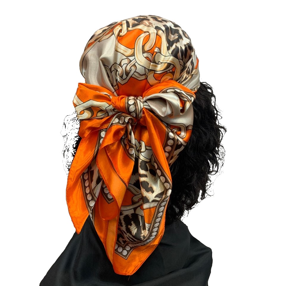 A luxurious 35" x 35" Multi Purpose Satin Scarf in vibrant colors, showcasing its silky texture and versatility for hair and fashion.