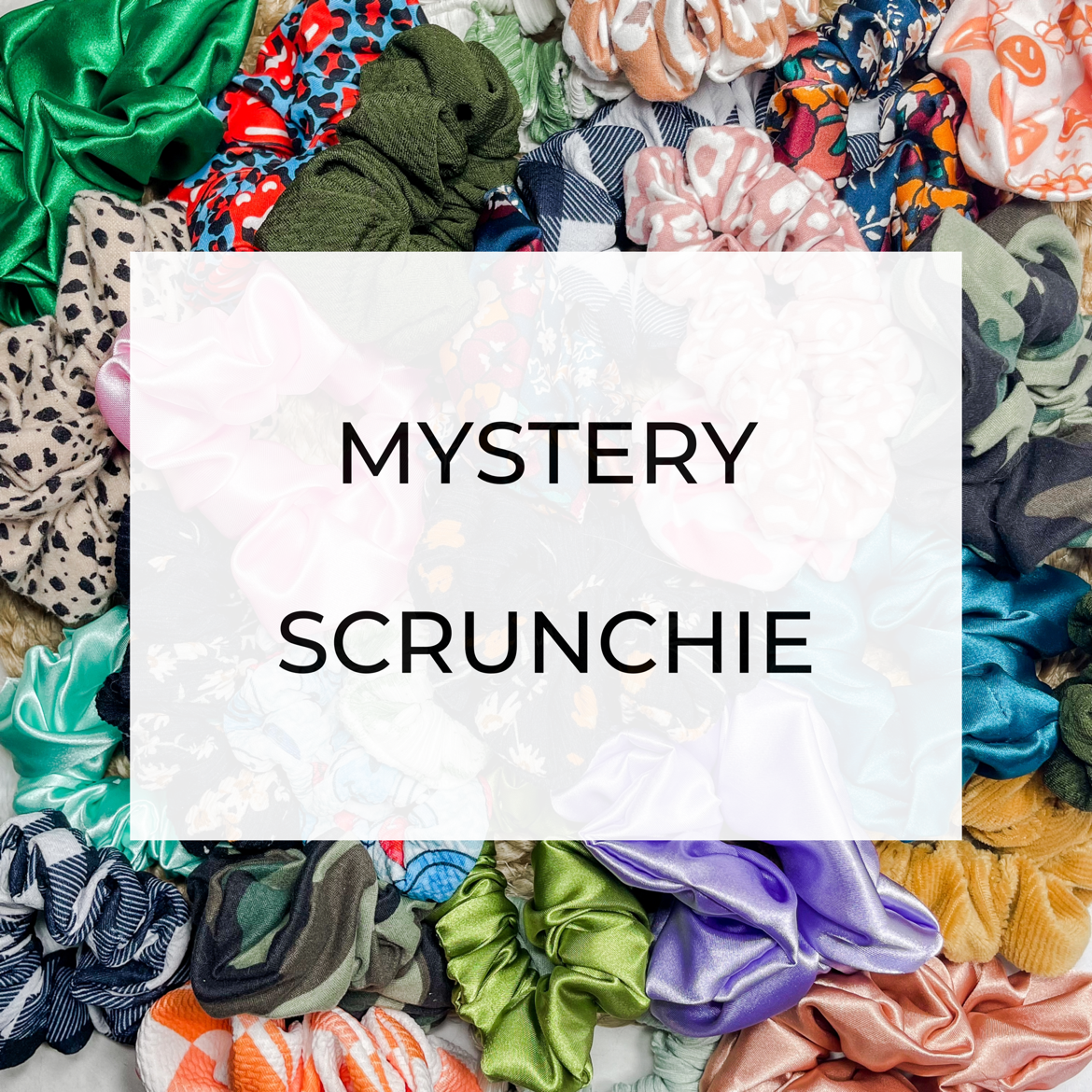 A colorful assortment of mystery scrunchies in various patterns and textures, showcasing their soft and stretchy material.