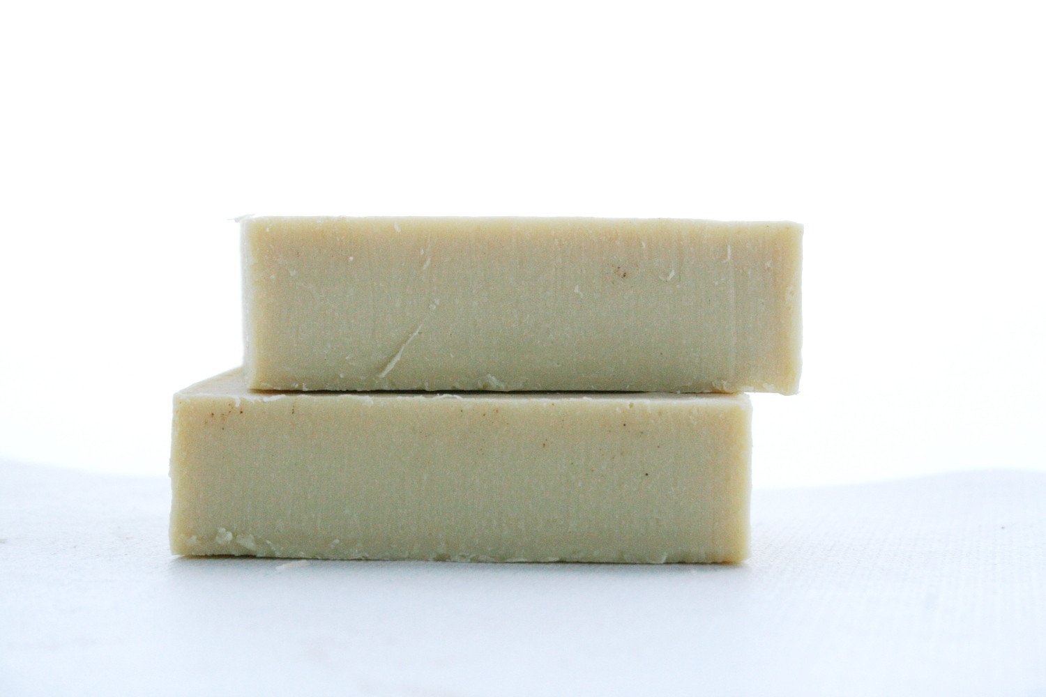 Natural Argan Shampoo Bar with rich ingredients, showcasing its texture and packaging, ideal for nourishing hair care.