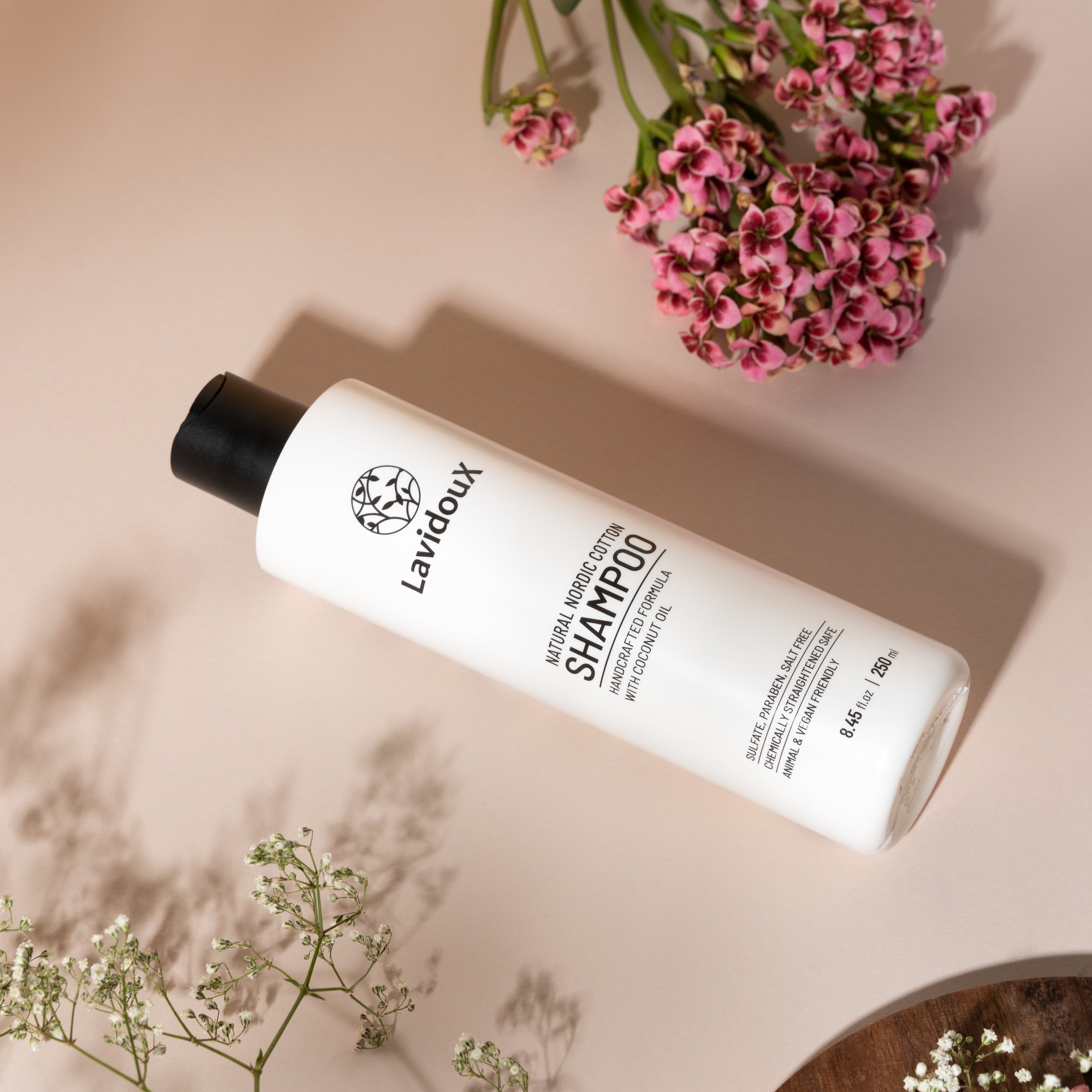 Nordic Cotton Shampoo bottle with natural ingredients, showcasing its gentle formula for all hair types.