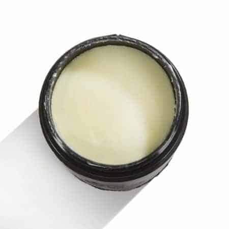 Pristine Beard Balm in a sleek container, showcasing its rich texture and appealing packaging, perfect for beard care and fragrance.