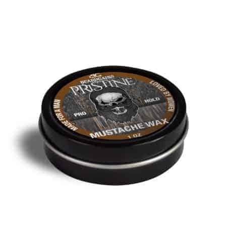 Pristine Mustache Wax tin with a rustic design, showcasing its organic ingredients and strong hold for mustache styling.