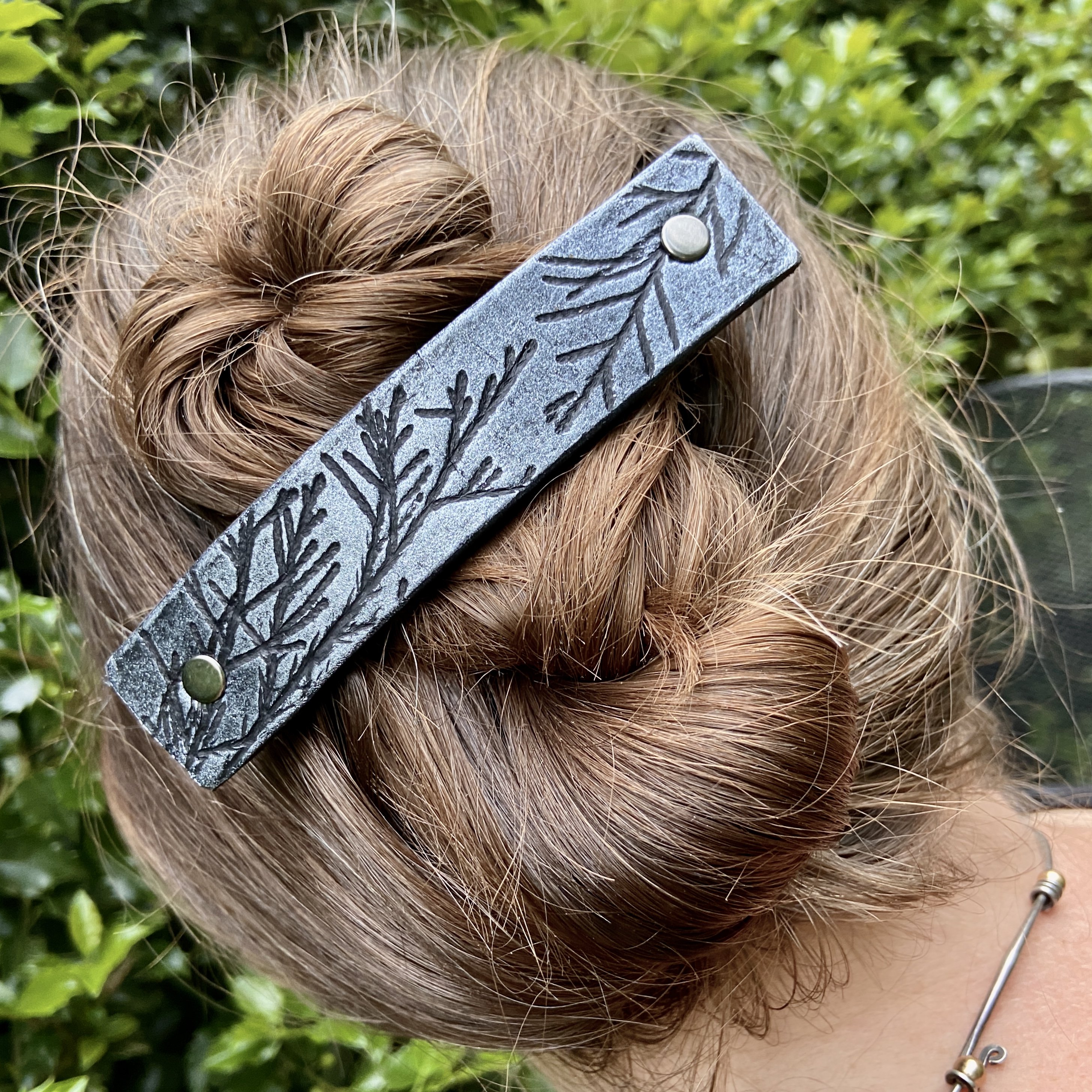 Silver Juniper Branches Leather Hair Barrette featuring embossed juniper designs on black leather.