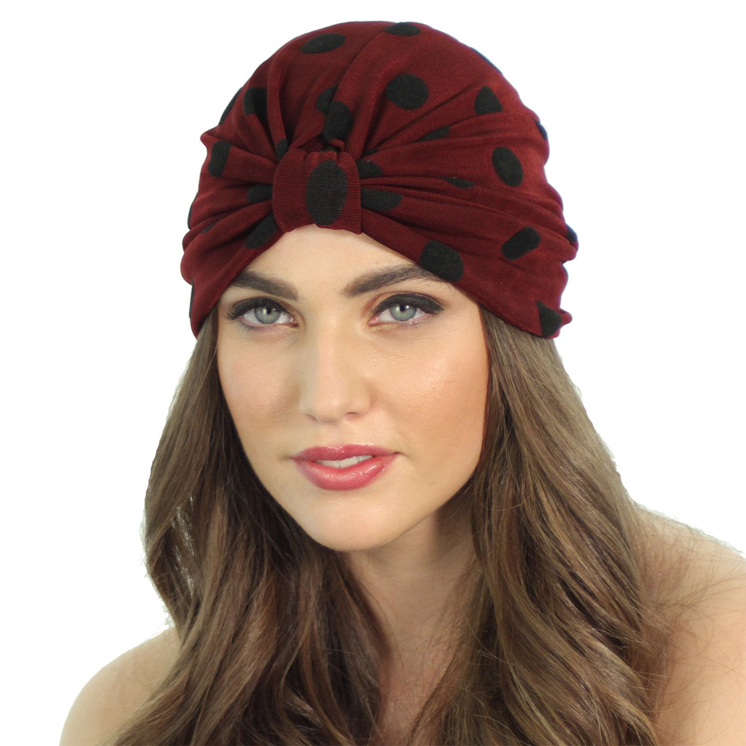 A stylish SLINKY DOT TURBAN featuring black velvet burnout polka dots, designed for comfort with a ruched back, perfect for cool weather.