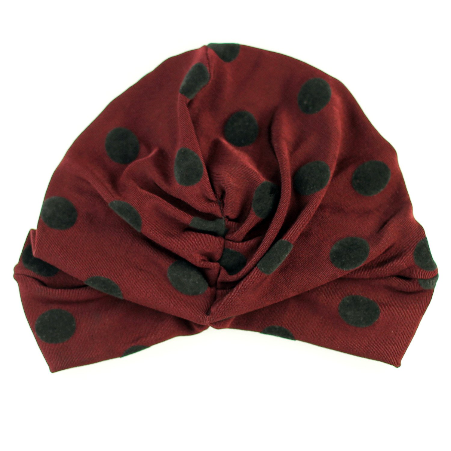 A stylish SLINKY DOT TURBAN featuring black velvet burnout polka dots, designed for comfort with a ruched back, perfect for cool weather.