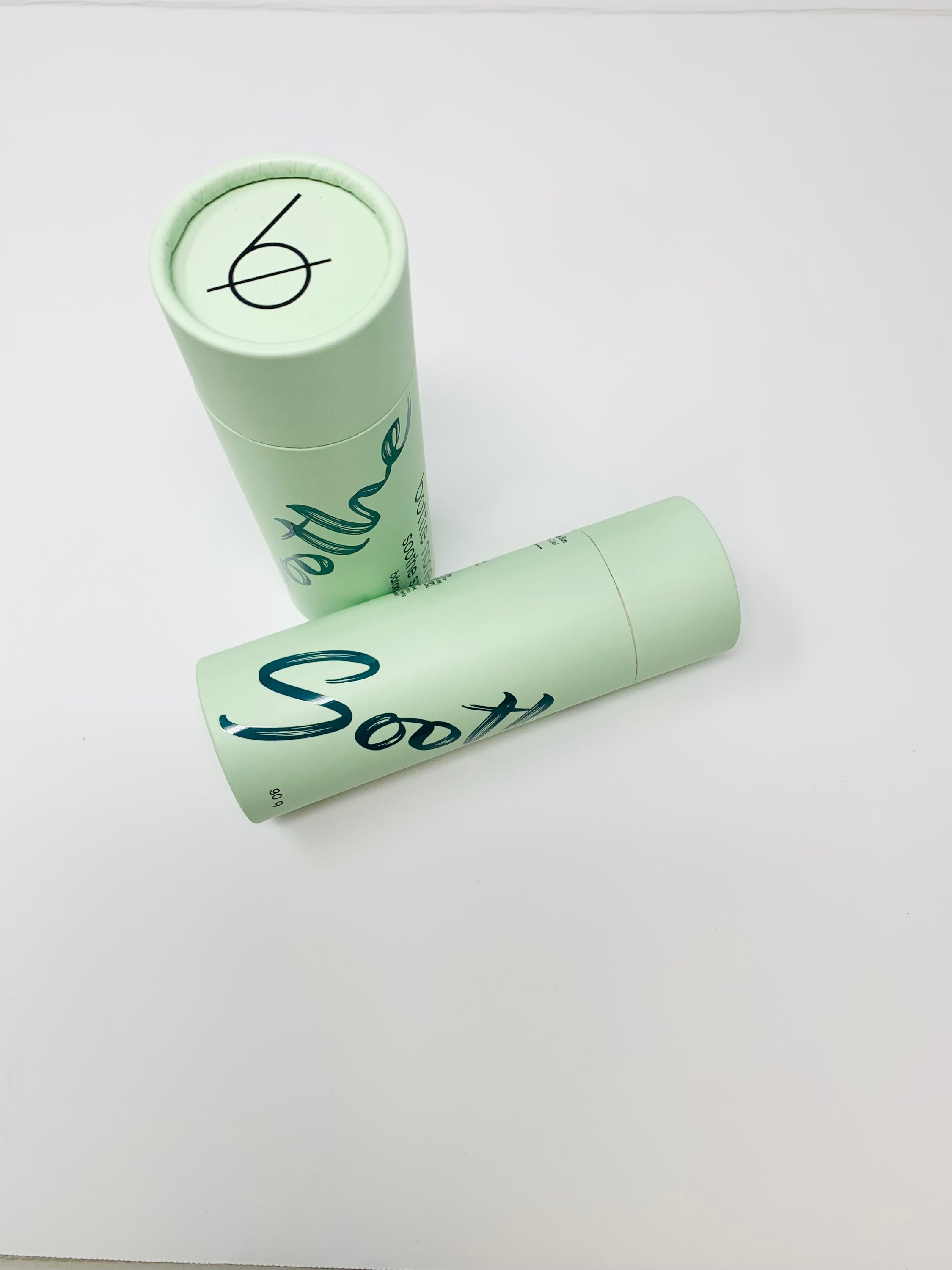 A close-up of the Soothe Stick tube showcasing its herbal ingredients and soothing properties, perfect for skin nourishment.