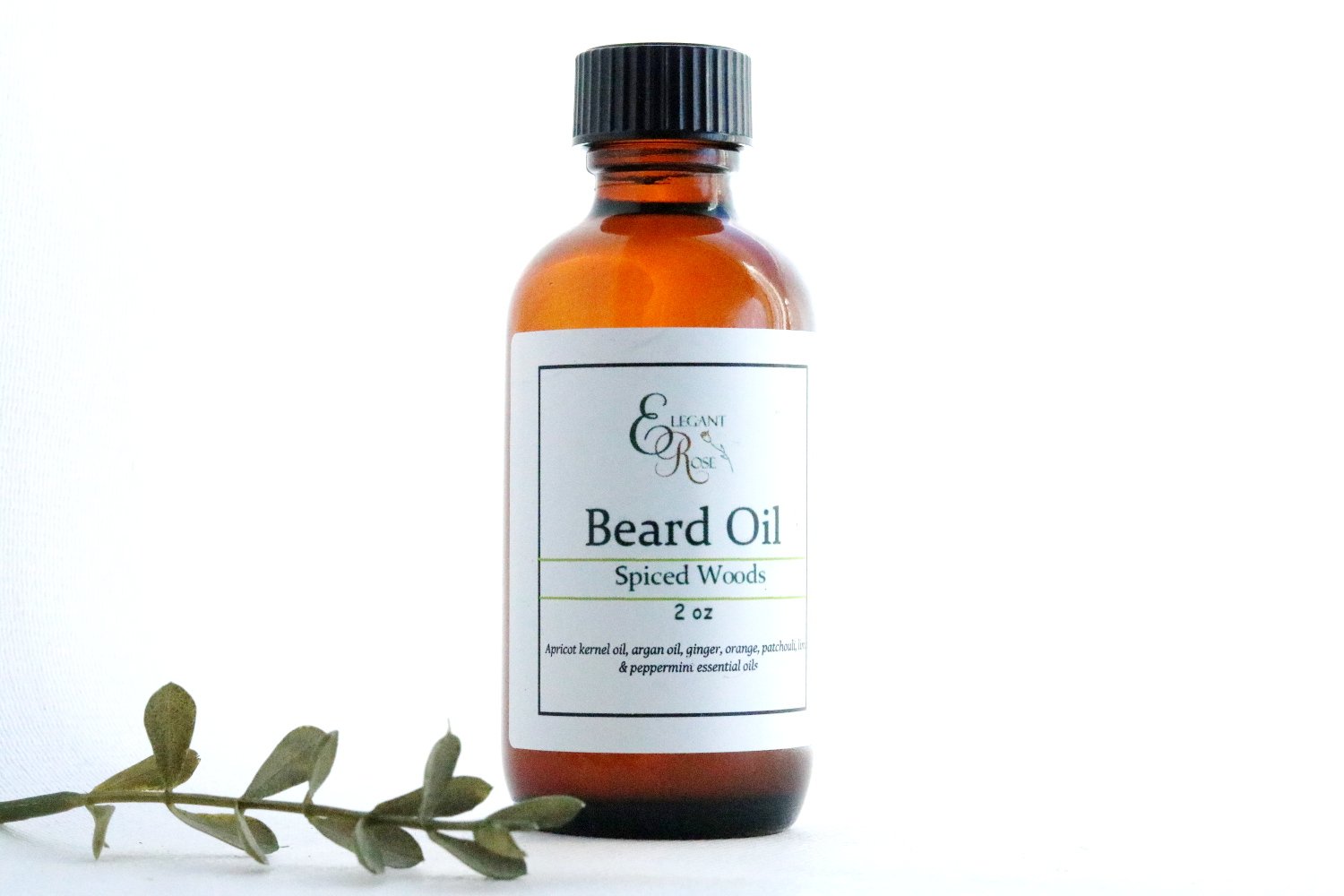 A 1.7 ounce bottle of Spiced Woods Natural Beard Oil with a wooden background, showcasing its earthy and natural essence.