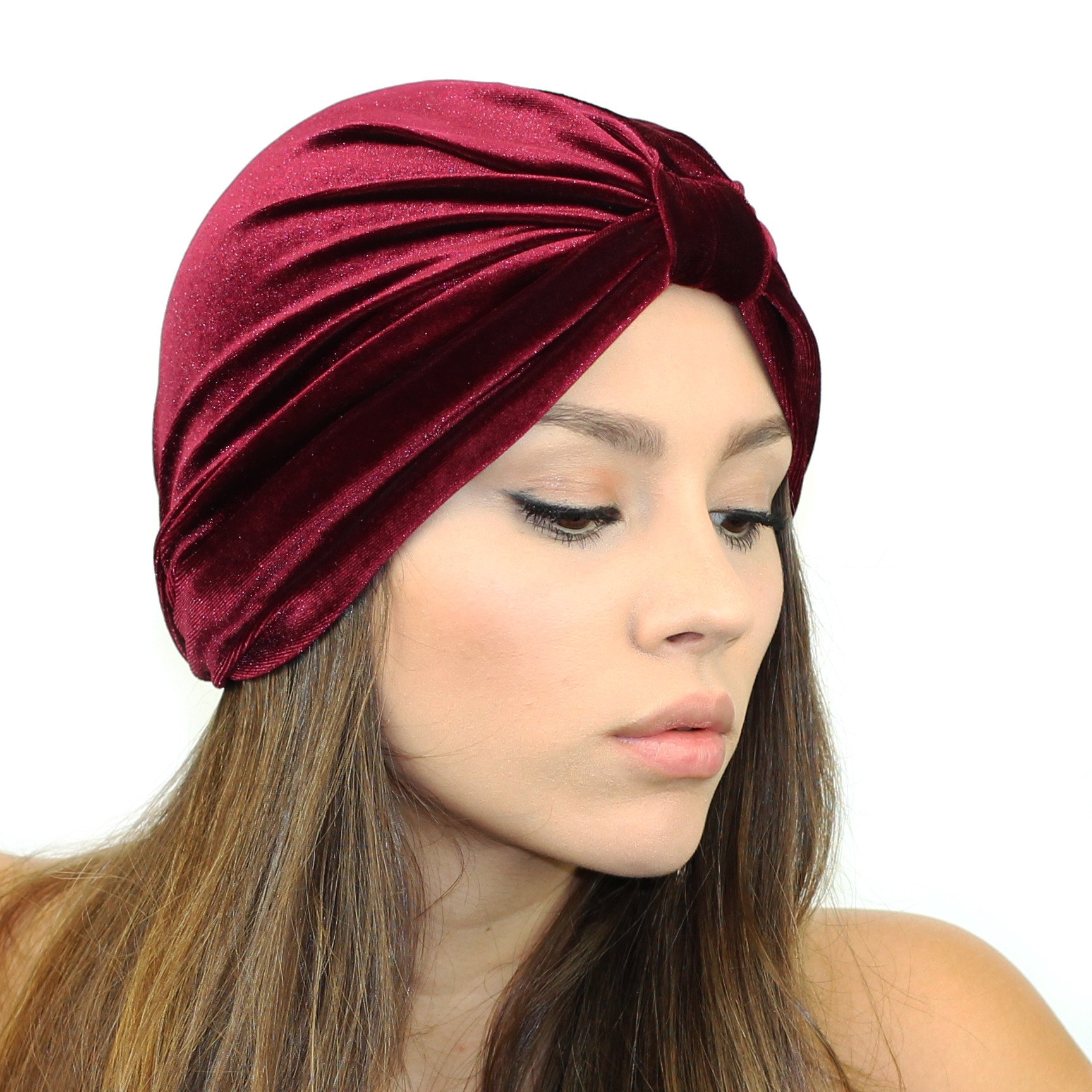 A stylish Stretch Velvet Turban in rich fabric, cinched at the back for a comfortable fit, suitable for various head sizes.