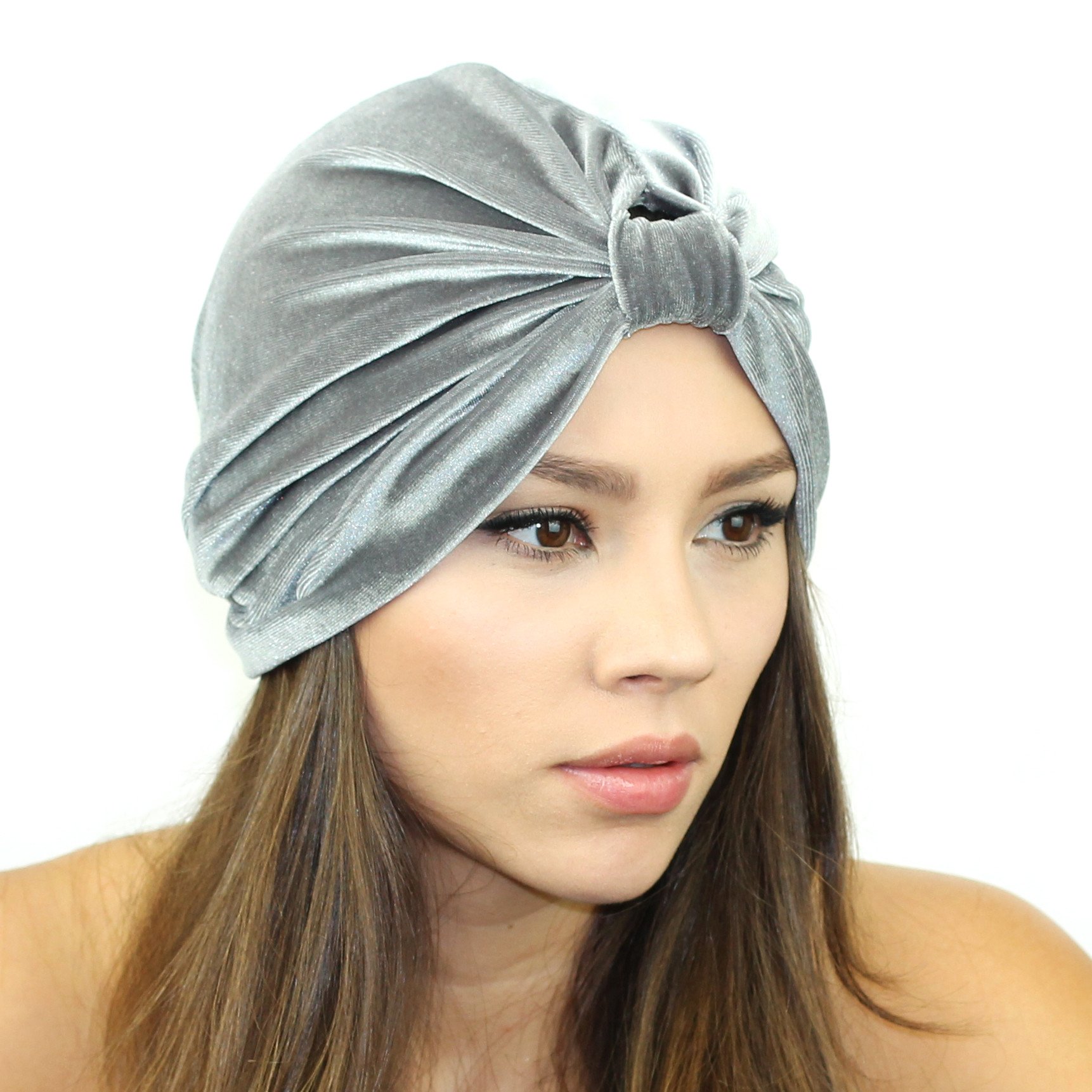 A stylish Stretch Velvet Turban in rich fabric, cinched at the back for a comfortable fit, suitable for various head sizes.