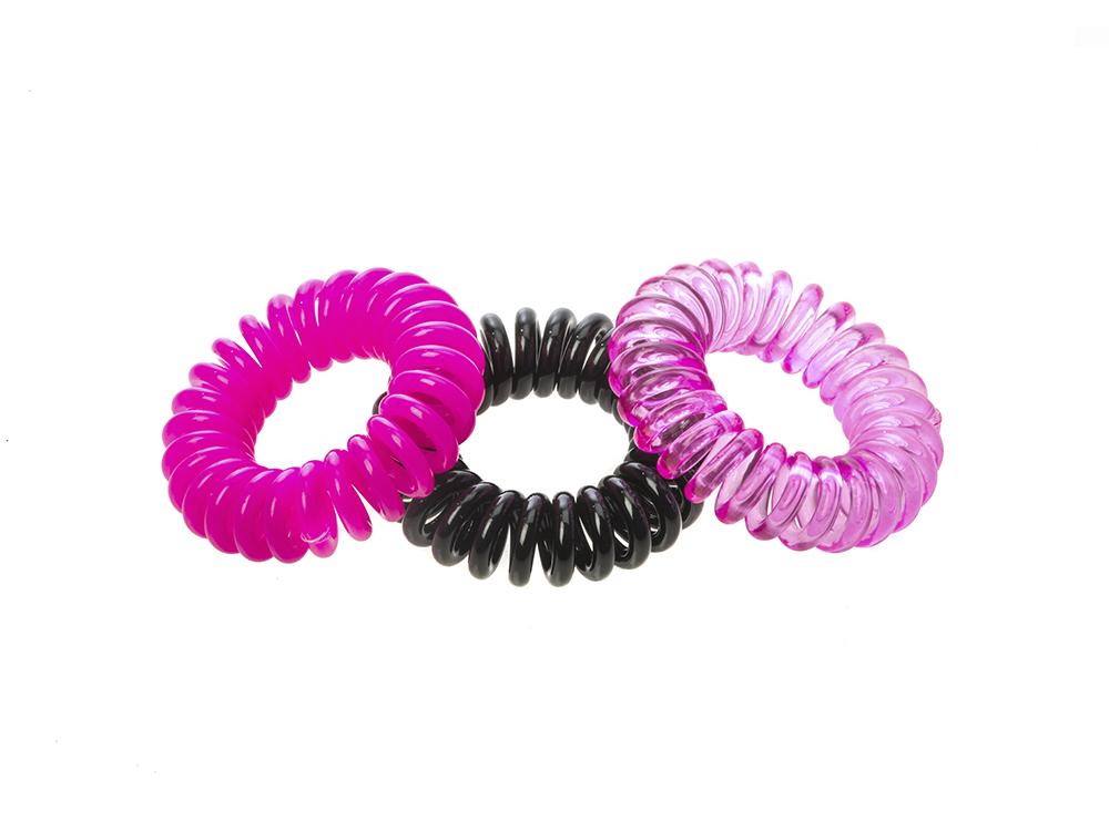 Sugar Twists® coil hair ties in various colors, showcasing their unique spiral design and eco-friendly materials.