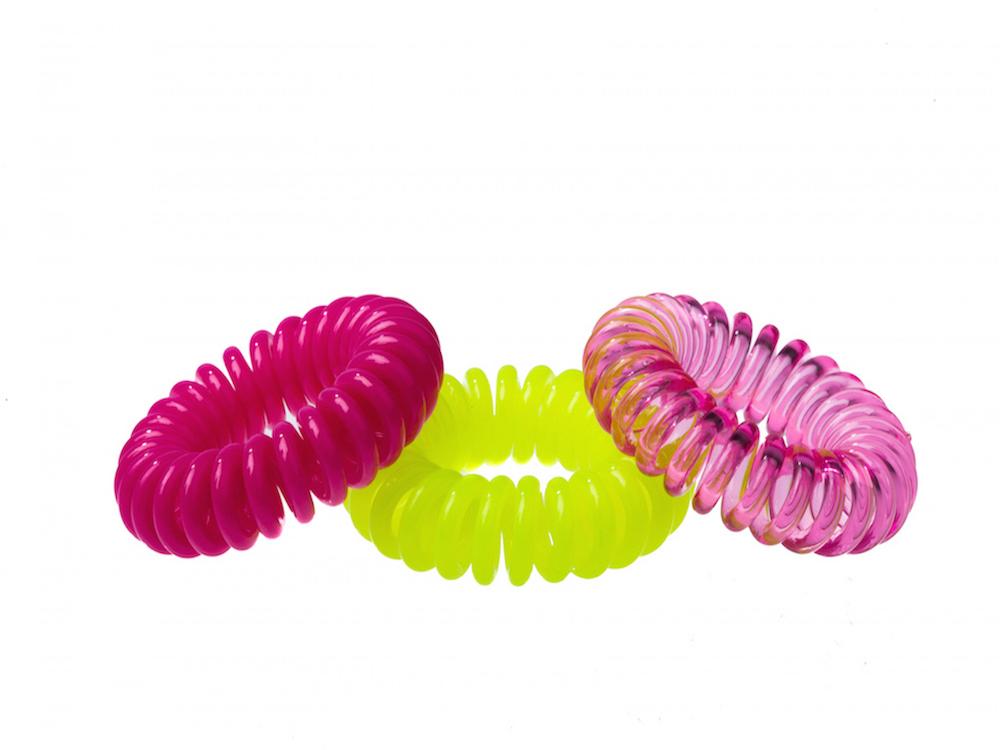 Sugar Twists® coil hair ties in various colors, showcasing their unique spiral design and eco-friendly materials.