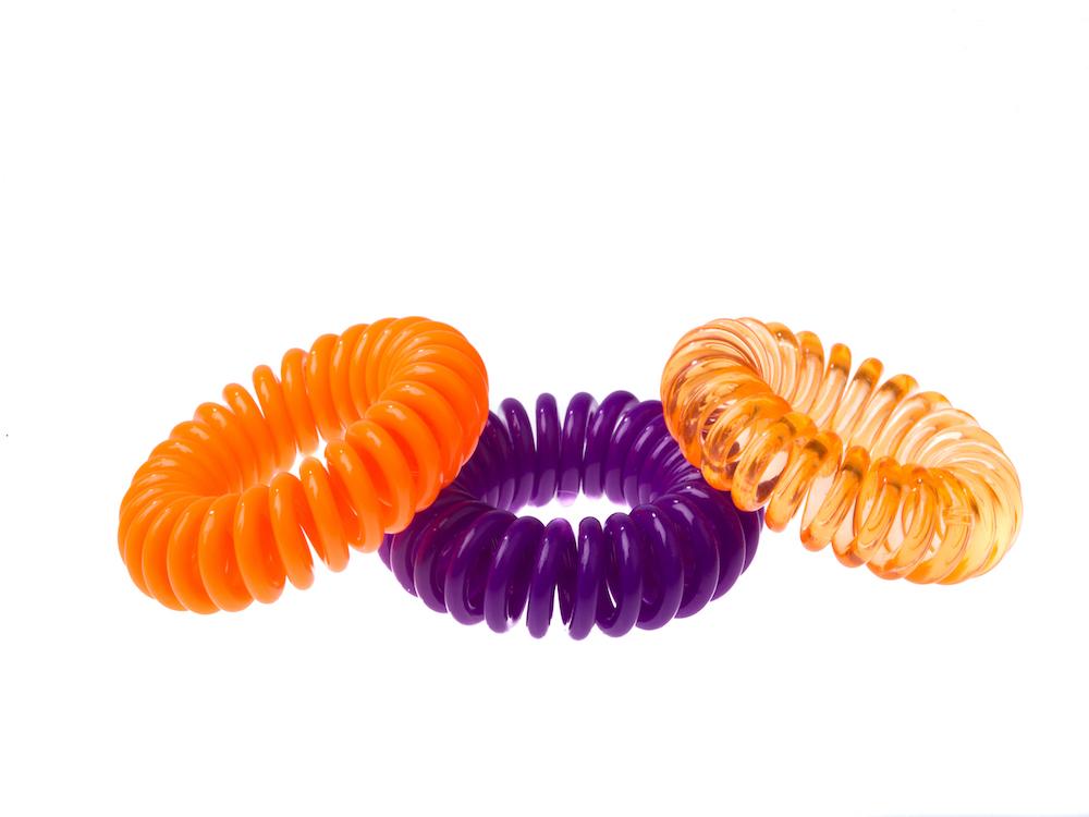 Sugar Twists® coil hair ties in various colors, showcasing their unique spiral design and eco-friendly materials.