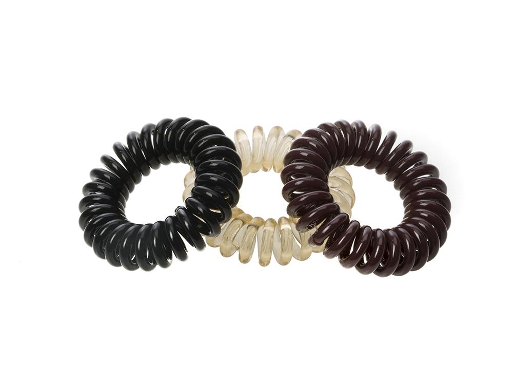 Sugar Twists® coil hair ties in various colors, showcasing their unique spiral design and eco-friendly materials.