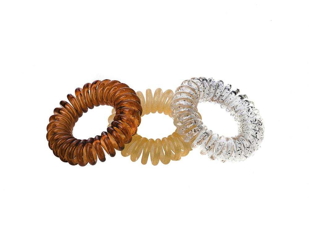 Sugar Twists® coil hair ties in various colors, showcasing their unique spiral design and eco-friendly materials.