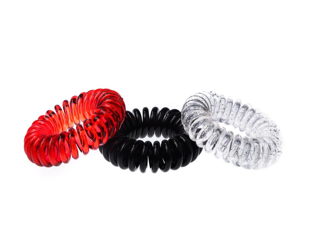 Sugar Twists® coil hair ties in various colors, showcasing their unique spiral design and eco-friendly materials.