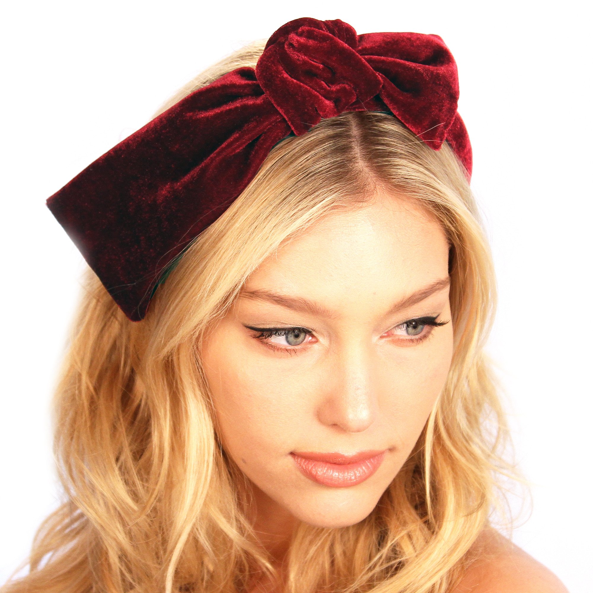 A stylish velvet knot headband in plush fabric, featuring a padded design for comfort and a chic knot detail, perfect for any occasion.