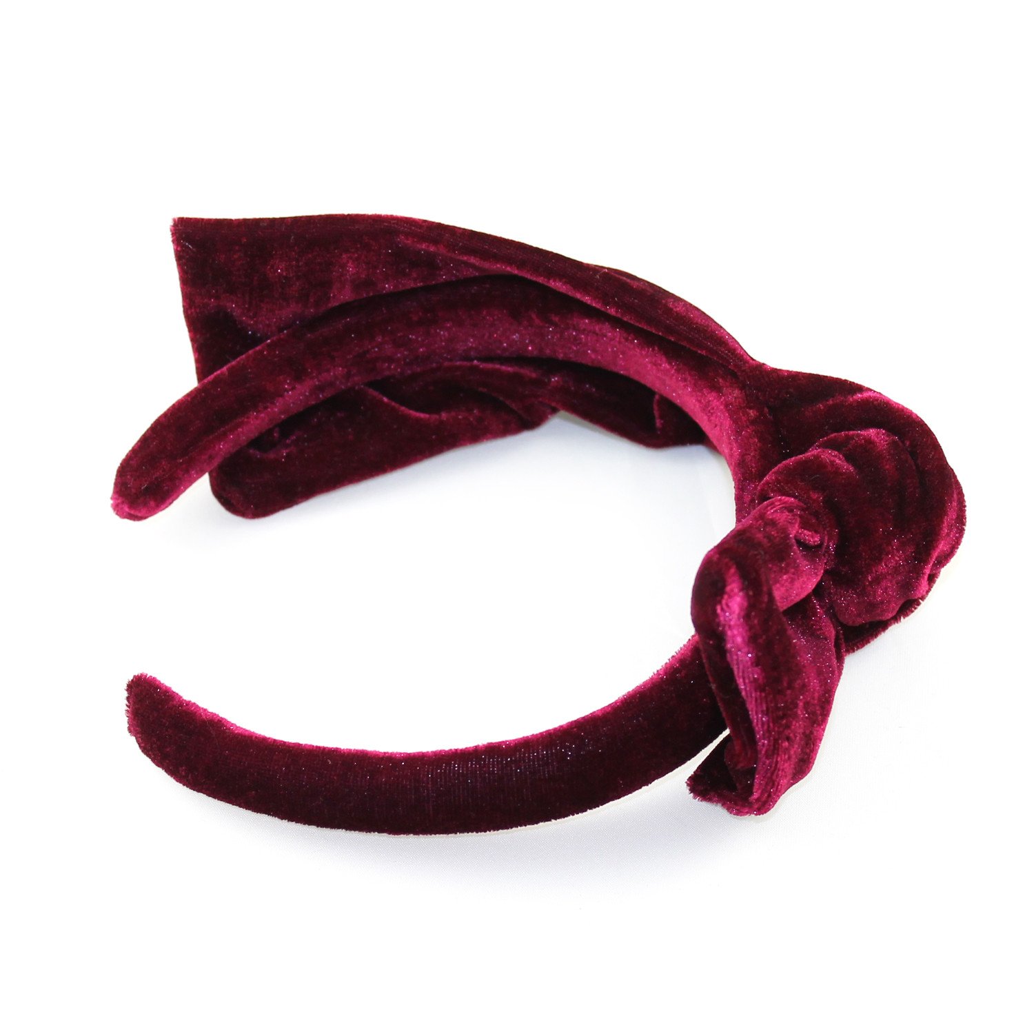 A stylish velvet knot headband in plush fabric, featuring a padded design for comfort and a chic knot detail, perfect for any occasion.