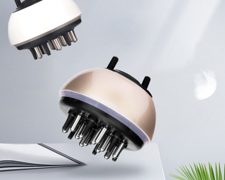 A compact and ergonomic handheld hair care massager designed for effective scalp application of hair growth serum.