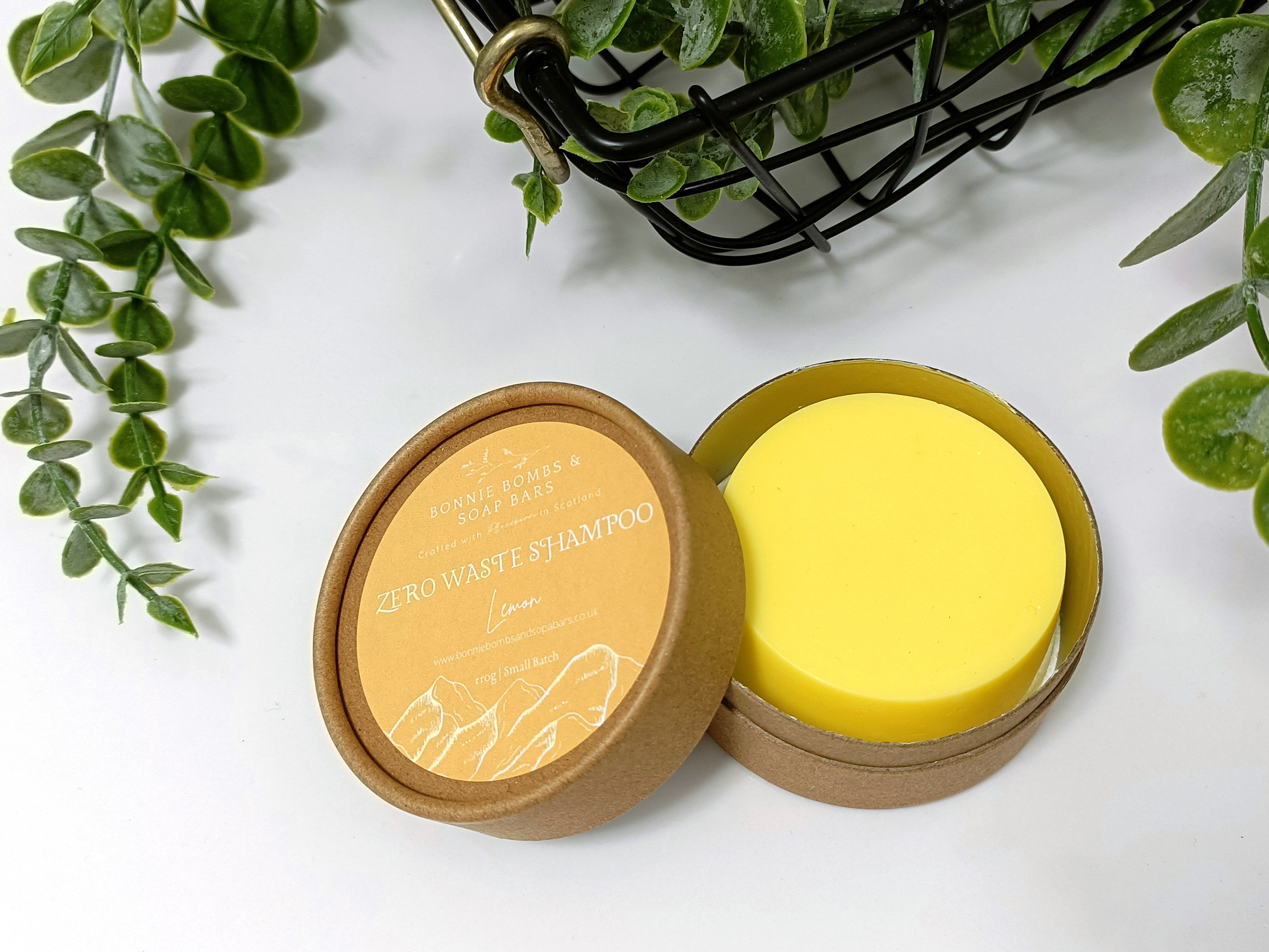 A vibrant lemon shampoo bar with natural ingredients, showcasing its eco-friendly packaging and fresh scent.