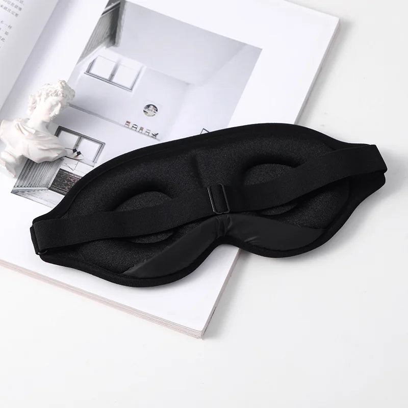 3D Portable Soft Eye Mask in black, designed for comfortable sleep, featuring an ergonomic shape and adjustable strap.