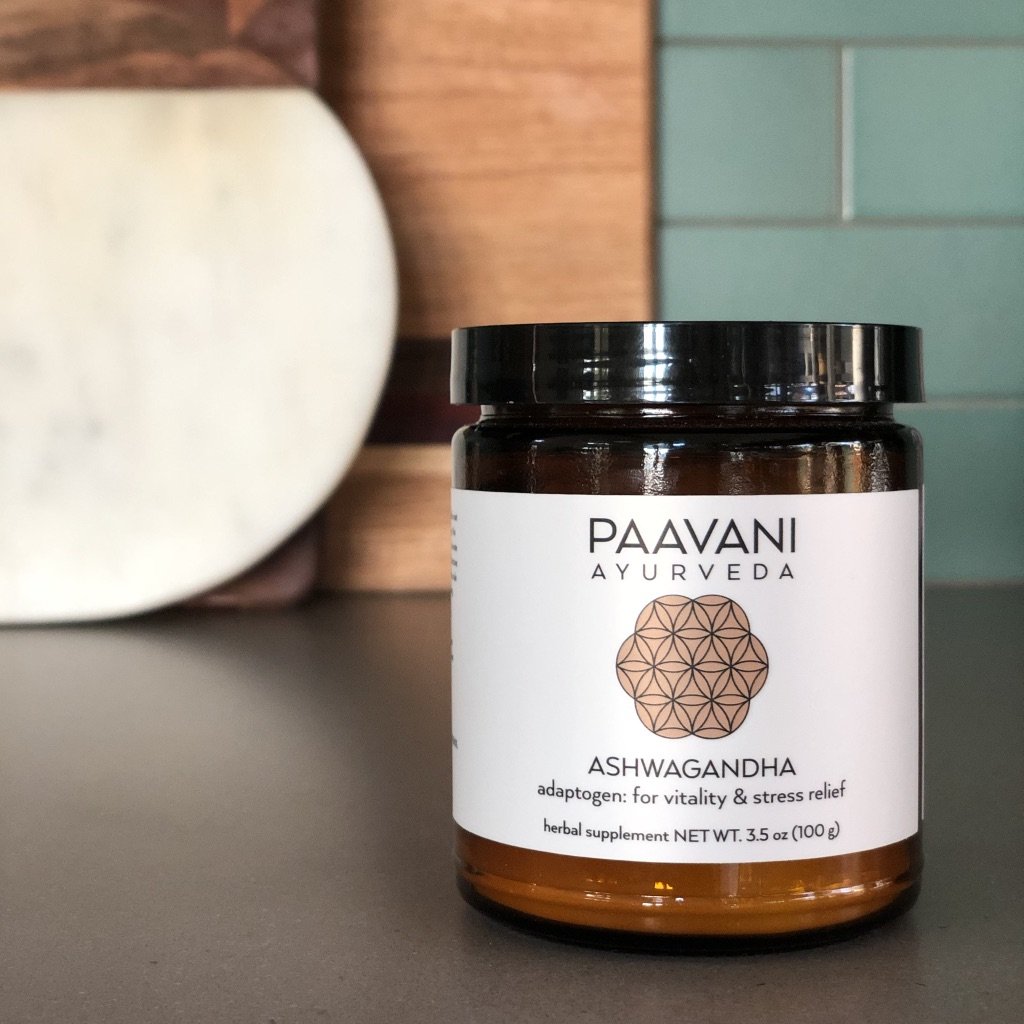 A 9 oz glass jar of Ashwagandha root powder, showcasing its earthy color and texture, symbolizing its Ayurvedic heritage and health benefits.