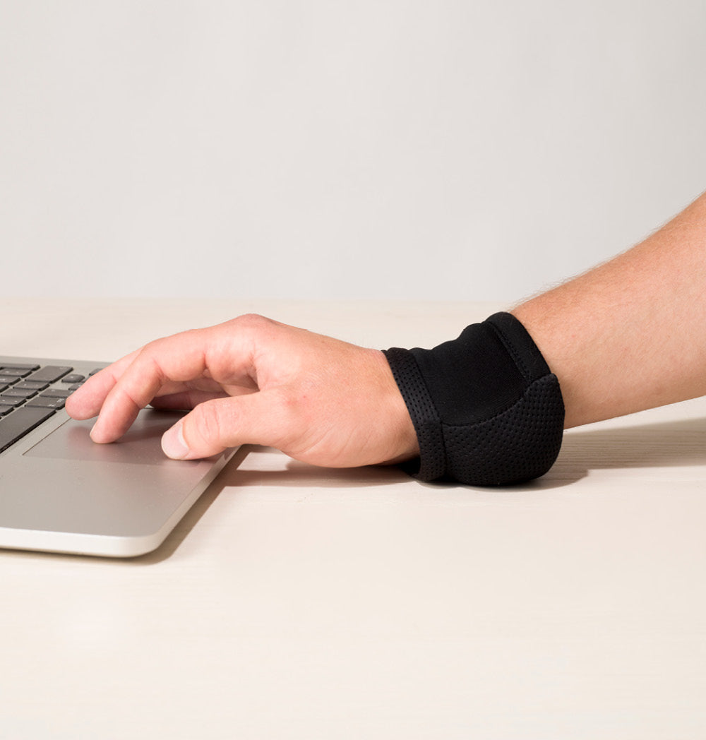 Carpal Ergonomic Wrist Support designed for comfort and pain relief, featuring a padded design suitable for computer use and gaming.