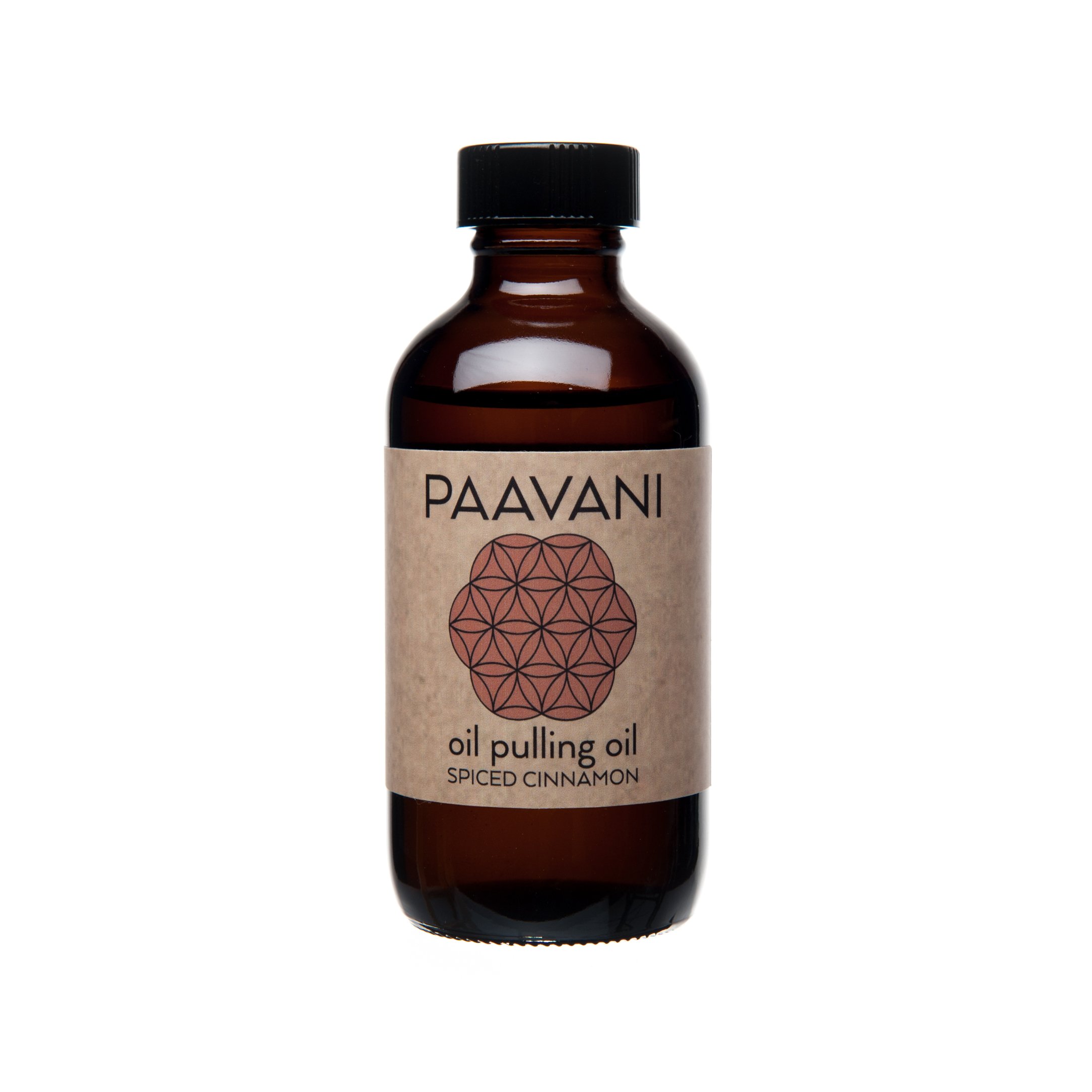 A bottle of Cinnamon Pulling Oil with a wooden spoon, showcasing its rich golden color and natural ingredients.