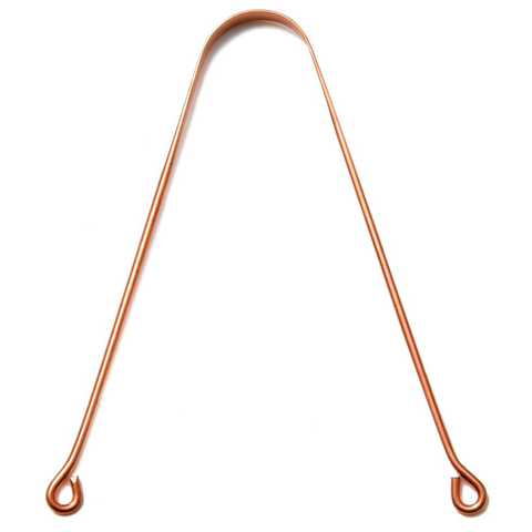 A Copper Tongue Cleaner with a sleek design, showcasing its shiny surface and ergonomic shape, accompanied by a muslin travel pouch for convenience.