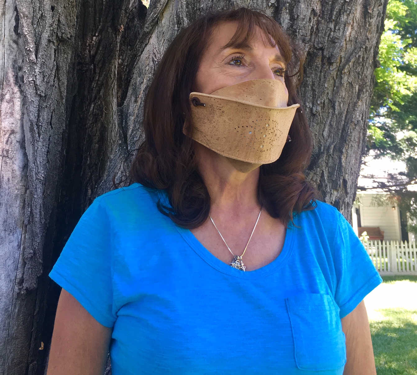 Eco-friendly cork face mask with adjustable ear loops, showcasing its lightweight and breathable design.