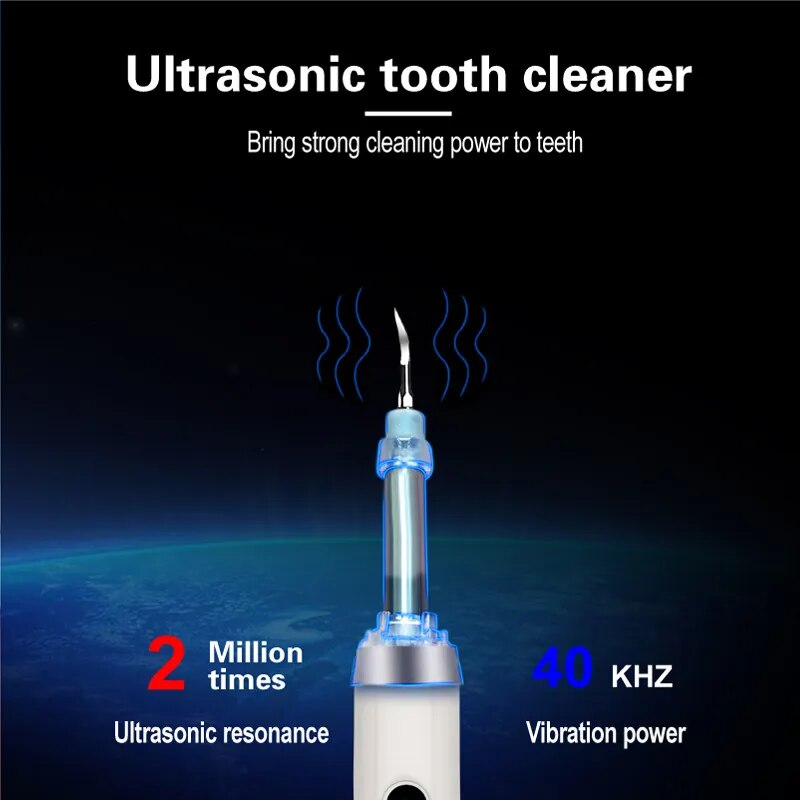 Ultrasonic Tooth Cleaner with stainless steel tips and USB charging cable, designed for effective dental care and stone removal.