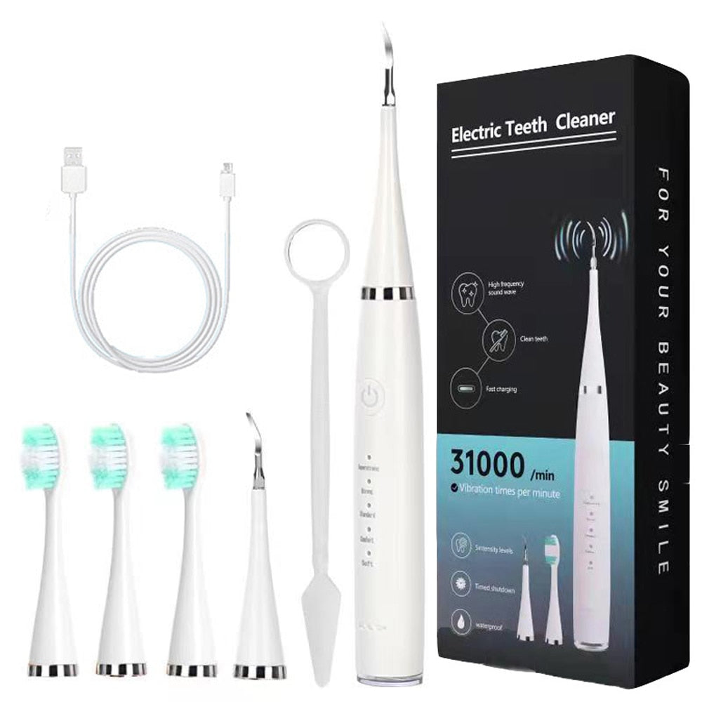 Electric Dental Calculus Remover with multiple accessories including toothbrush heads and USB charging cable, designed for effective teeth cleaning.