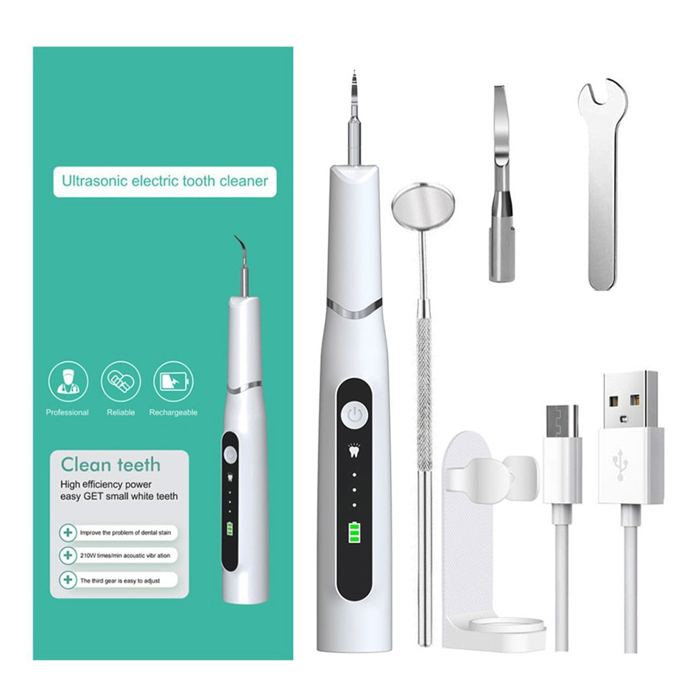 Electric Dental Calculus Remover with multiple cleaning heads and USB charging cable, designed for effective dental hygiene.