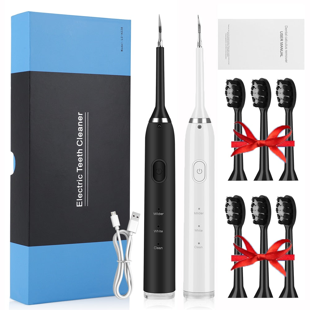 Electric Dental Scaler Teeth Whitening Device with multiple brush heads and USB charging cable, designed for effective teeth cleaning.