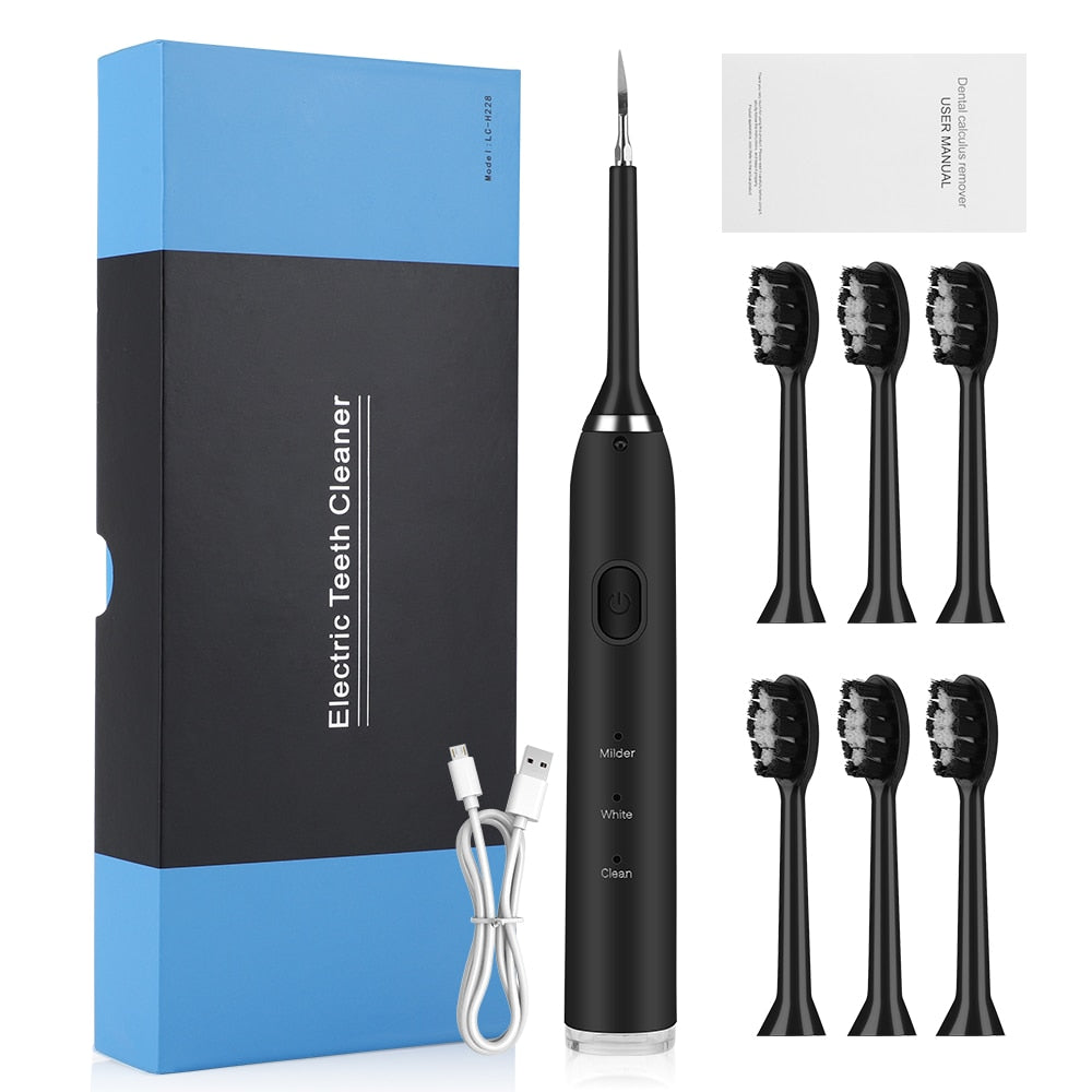 Electric Dental Scaler Teeth Whitening Device with multiple brush heads and USB charging cable, designed for effective teeth cleaning.