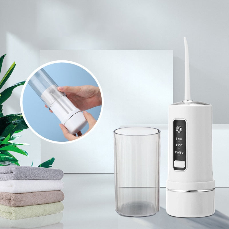 Electric Oral Irrigator Foldable Dental Water Jet Flosser with USB charging and multiple nozzles, designed for effective oral hygiene.