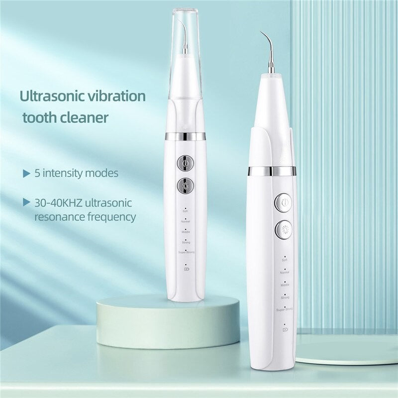 Electric Sonic Dental Whitener Scaler with multiple tips and USB charging cord, designed for effective teeth cleaning and tartar removal.