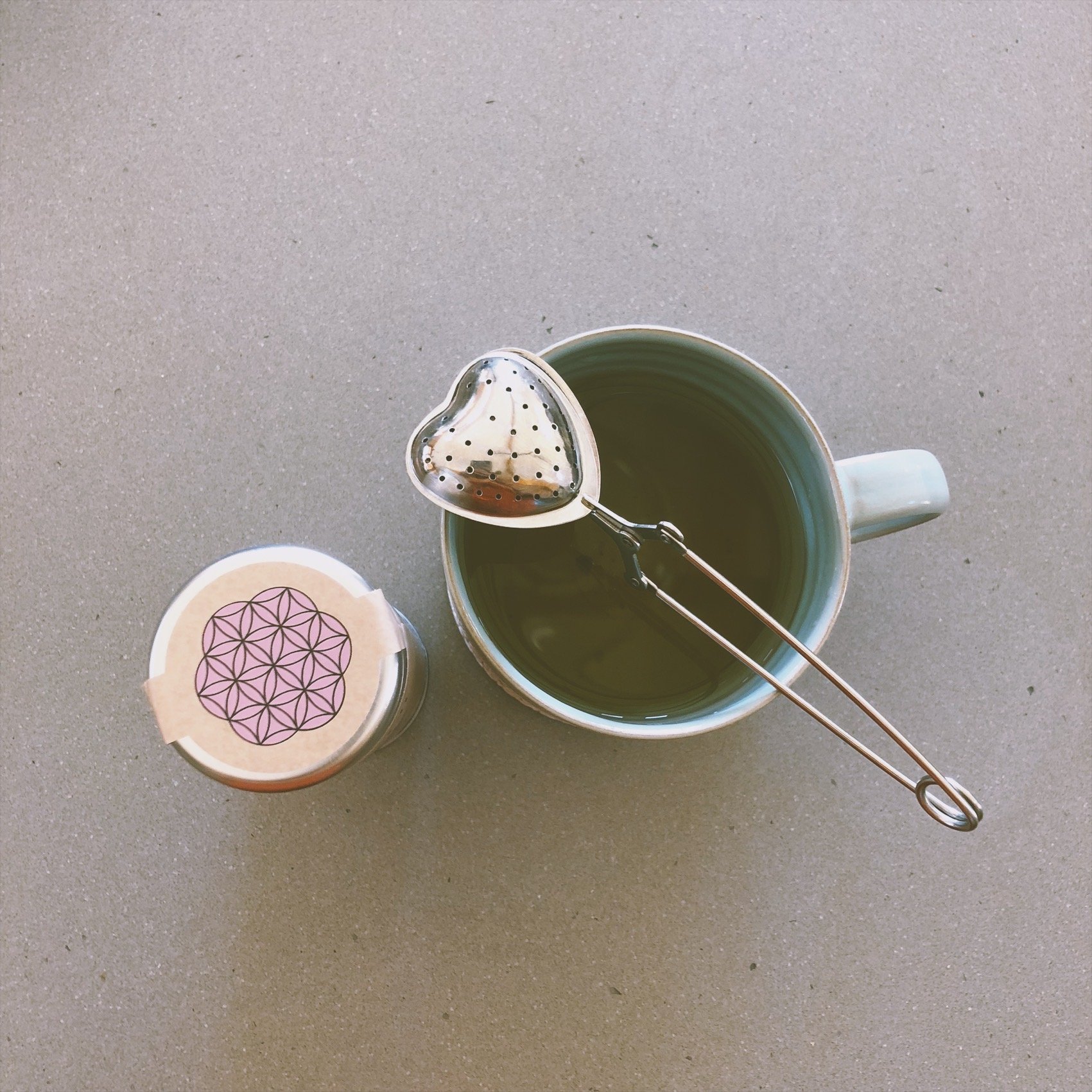 Heart-shaped stainless steel tea infuser designed for brewing loose leaf tea, showcasing its elegant design and functionality.