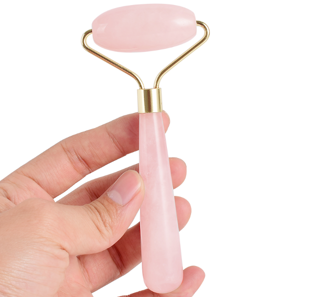 High Quality Women's Roller Massage Tool made of rose quartz, designed for facial and body massage, promoting relaxation and skin health.