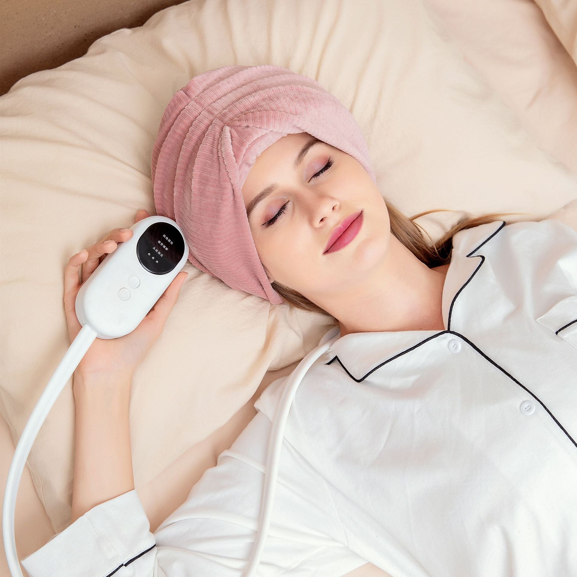 Home Air Wave Head Massager in pink and gray, showcasing its ergonomic design and control buttons for a relaxing head massage experience.