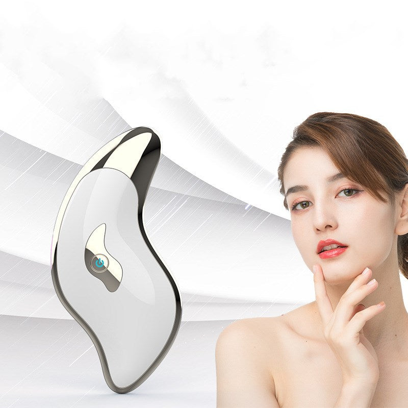 Household Facial Heating and Face-lifting Device in white color with a scraping board, designed for home skincare.