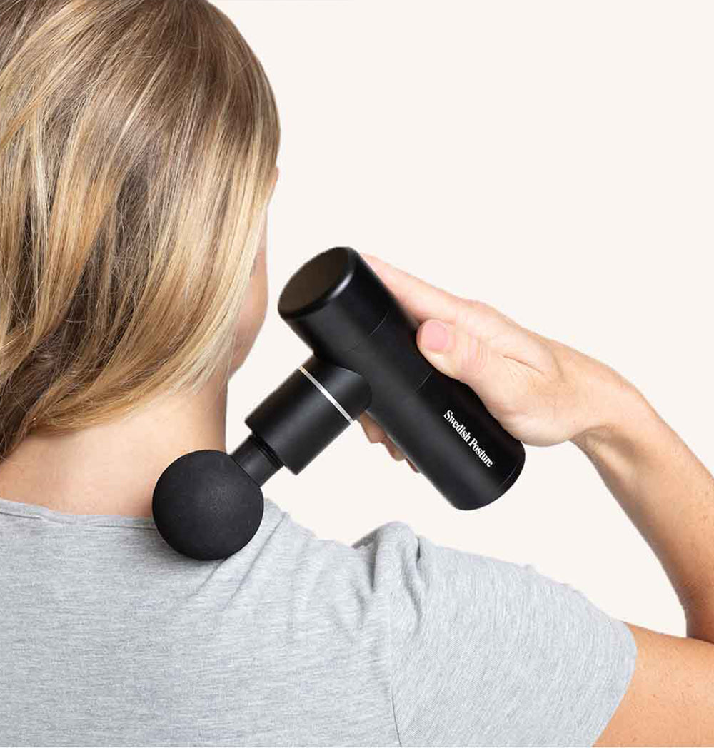 Compact Massage Gun Mini Recovery with four interchangeable heads for muscle relief.