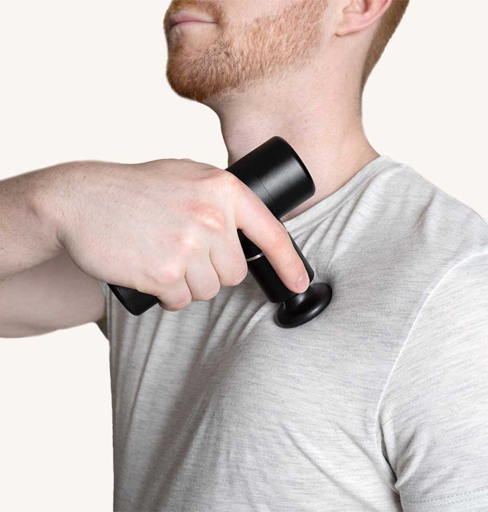 Compact Massage Gun Mini Recovery with four interchangeable heads for muscle relief.