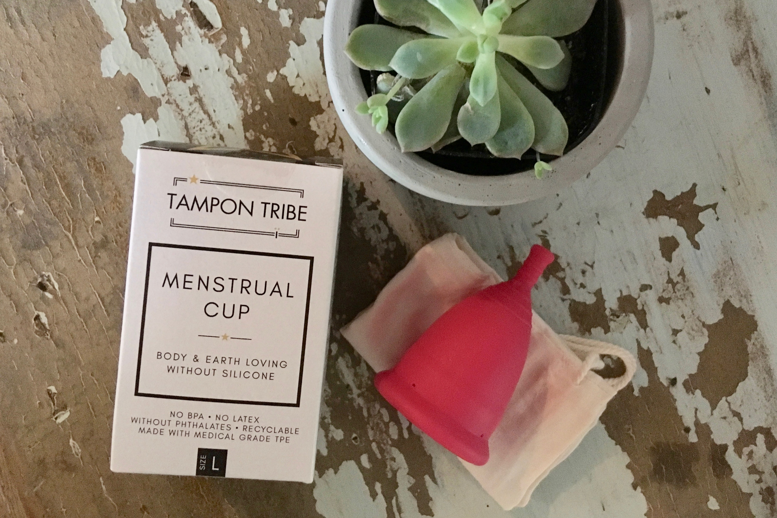 Tampon Tribe Menstrual Cup made from medical-grade TPE, showcasing its soft and flexible design, available in medium and large sizes.