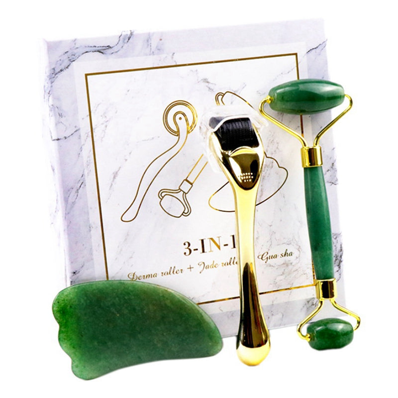 Micro-needle Powder Crystal Roller Jade Massager set including a pink roller, claw scraping board, and micro needle in an elegant gift box.