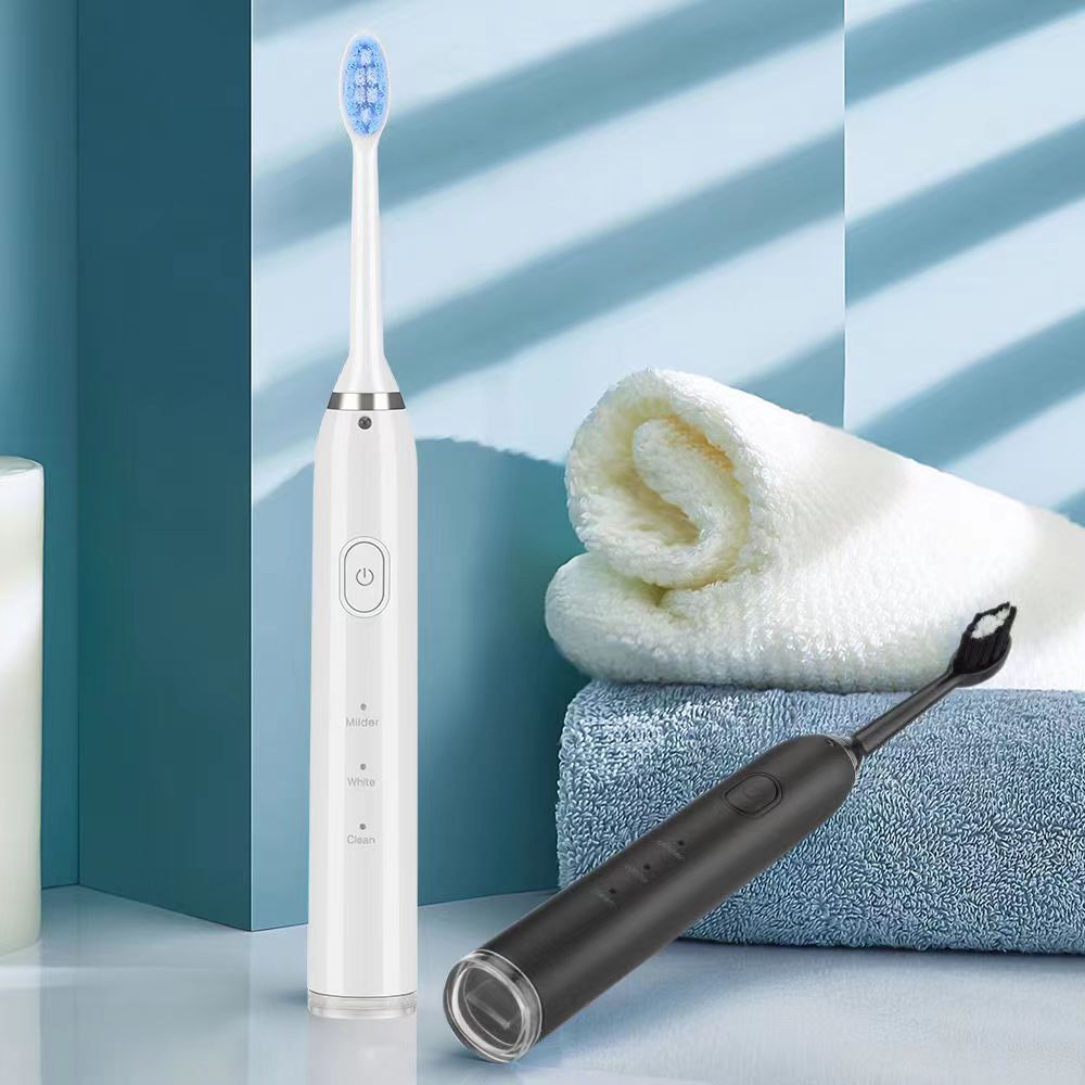 New Electric Teeth Cleaner Sonic Toothbrush with multiple heads and USB charging cable, designed for effective dental care.