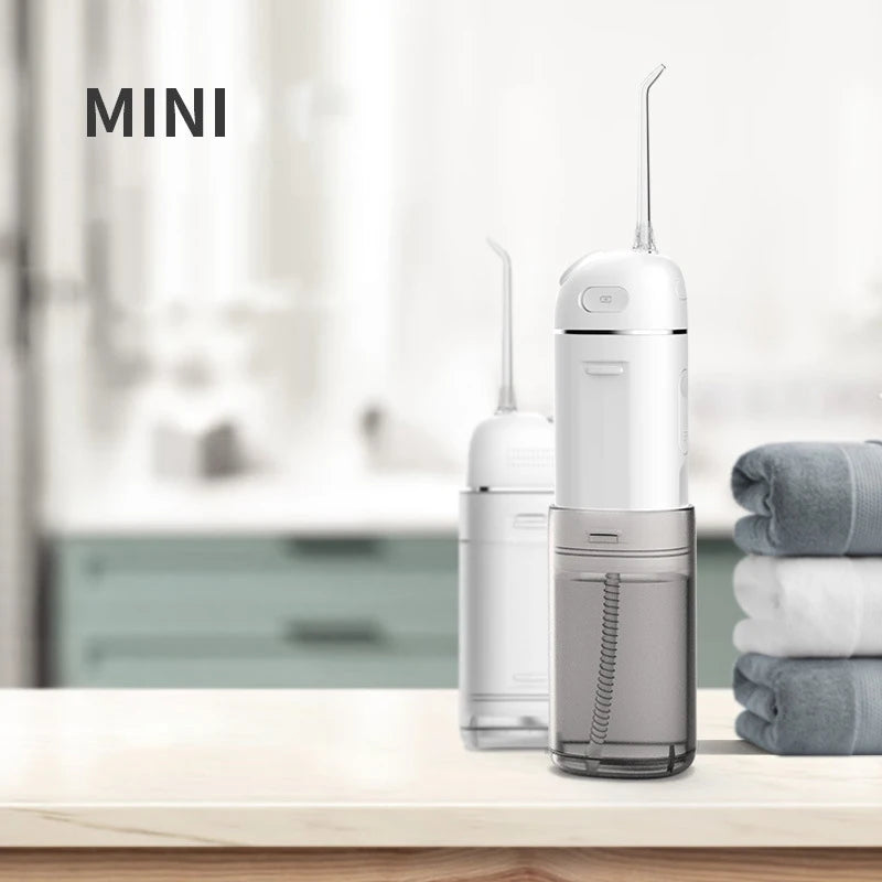 Portable mini Oral Irrigator Dental Thread Irrigation Water Flosser with a sleek design, IPX7 waterproof rating, and Type-C charging port.