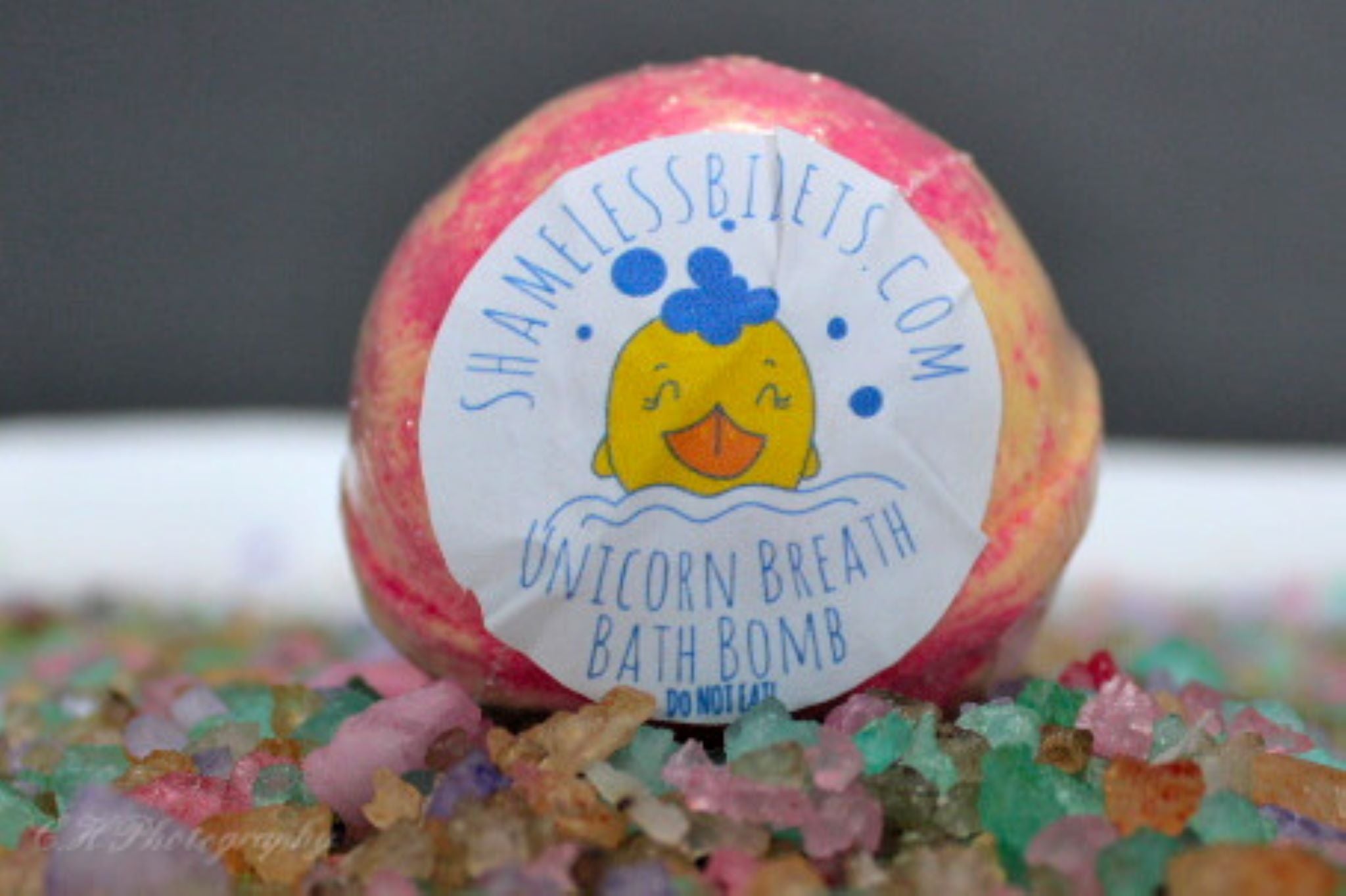 Colorful bath bomb with label.