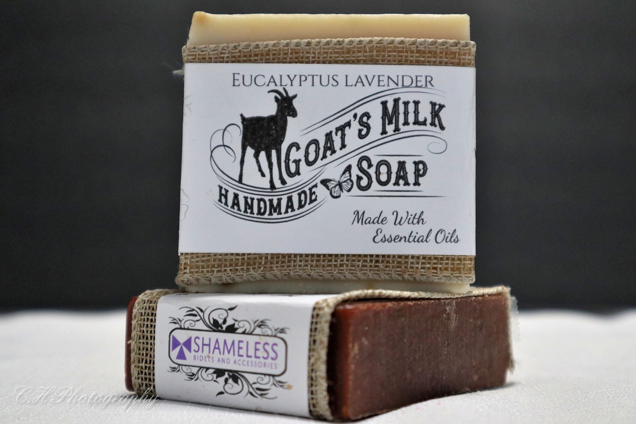 A bar of Organic Goat Milk Soap with natural ingredients, showcasing its creamy texture and organic label.