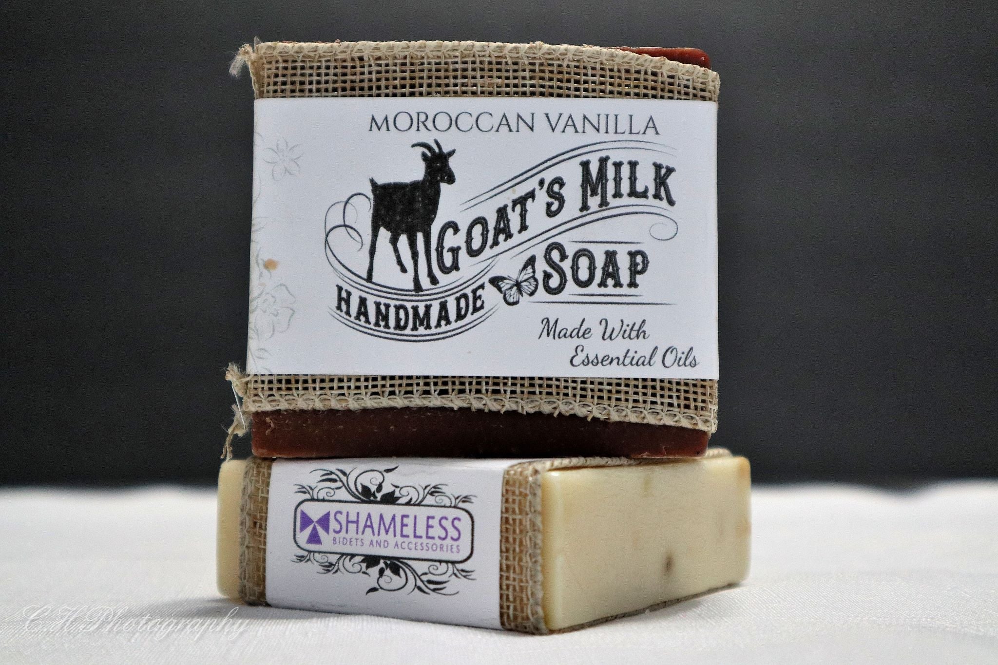 A bar of Organic Goat Milk Soap with natural ingredients, showcasing its creamy texture and organic label.